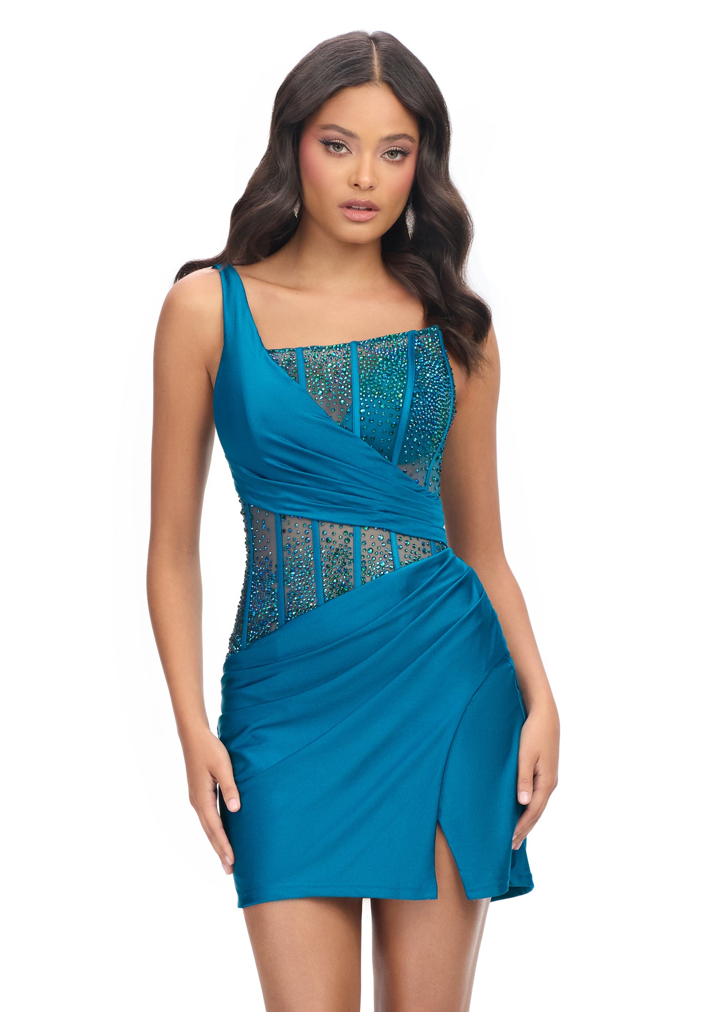 Ashley Lauren 4691&nbsp;The perfect cocktail dress does exist! Featuring a fully beaded corset bustier and left leg slit, this dress will have you looking extra fabulous!

One Shoulder
Corset Bustier
Press on Stones
Wrap Skirt
Colors:&nbsp;Peacock, Black, Red, Magenta, Purple, Royal