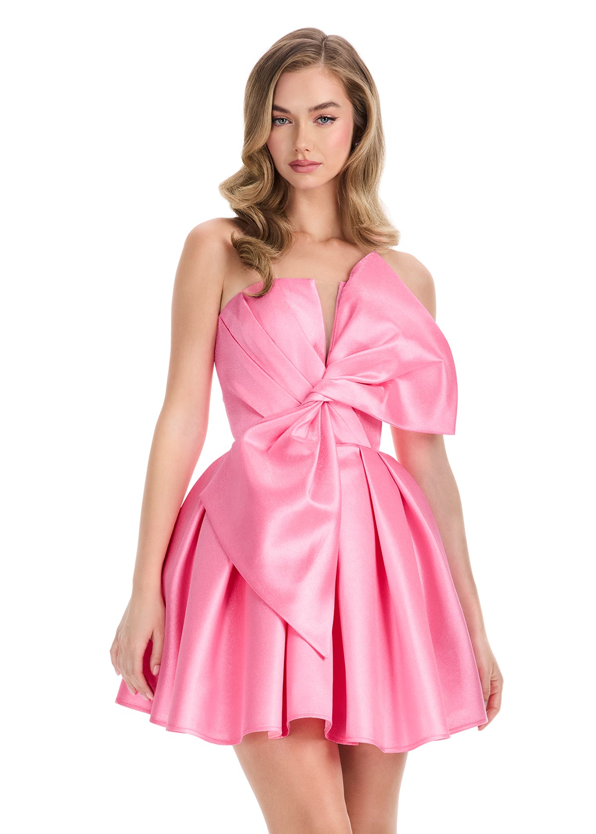 Elevate your formal occasion with the Ashley Lauren 4816 cocktail dress, featuring a flattering short fit and flared silhouette. The elegant pleated design is complemented by an oversized bow, adding a refined touch to the V-neck neckline. Perfect for homecoming or any special event, this dress combines classic sophistication with modern charm for a truly memorable look. ASHLEYlauren Style 4816 is a short Mikado dress that combines playful charm with bold sophistication. Featuring a structured bodice and ov