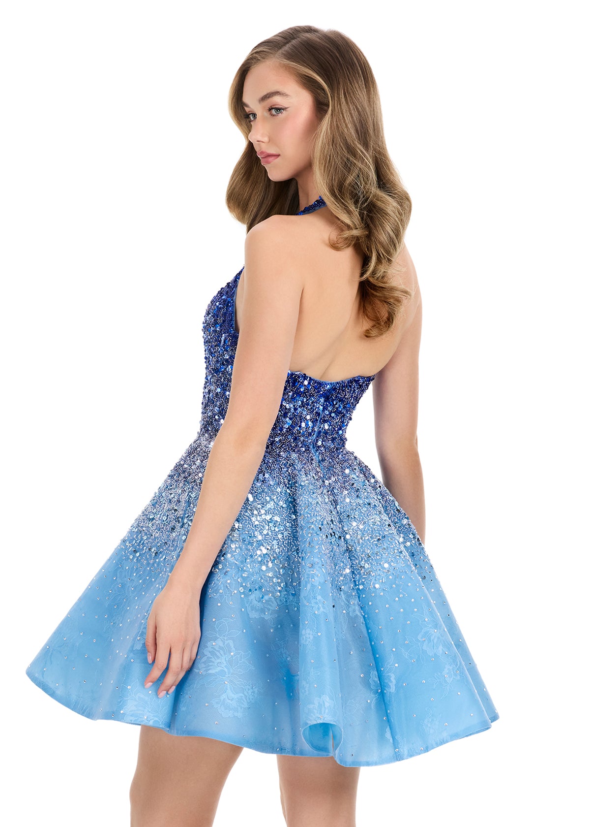 Elevate your evening with the Ashley Lauren 4833 dress, featuring a delicate ombre sequin design that catches the light with every movement. This short, flared silhouette is complemented by a halter neckline and a flattering V-neck, creating a refined look perfect for homecoming or cocktail events. Its shimmering finish and elegant cut ensure you stand out with effortless sophistication. Step into the spotlight with ASHLEYlauren Style 4833, a fully beaded mini dress featuring an ombré effect and lace detail