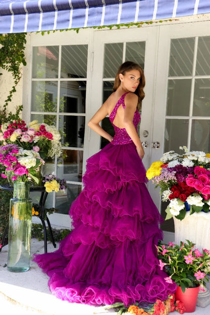 Step into the spotlight with the Ava Presley 29236, a dazzling gown that combines glamour with a touch of drama. This one-shoulder dress features a fully sequined bodice that cascades into a voluminous layered skirt with a high slit, adding movement and flair to your look. Perfect for any formal event where you want to make a bold statement, this gown is designed to leave a lasting impression.
