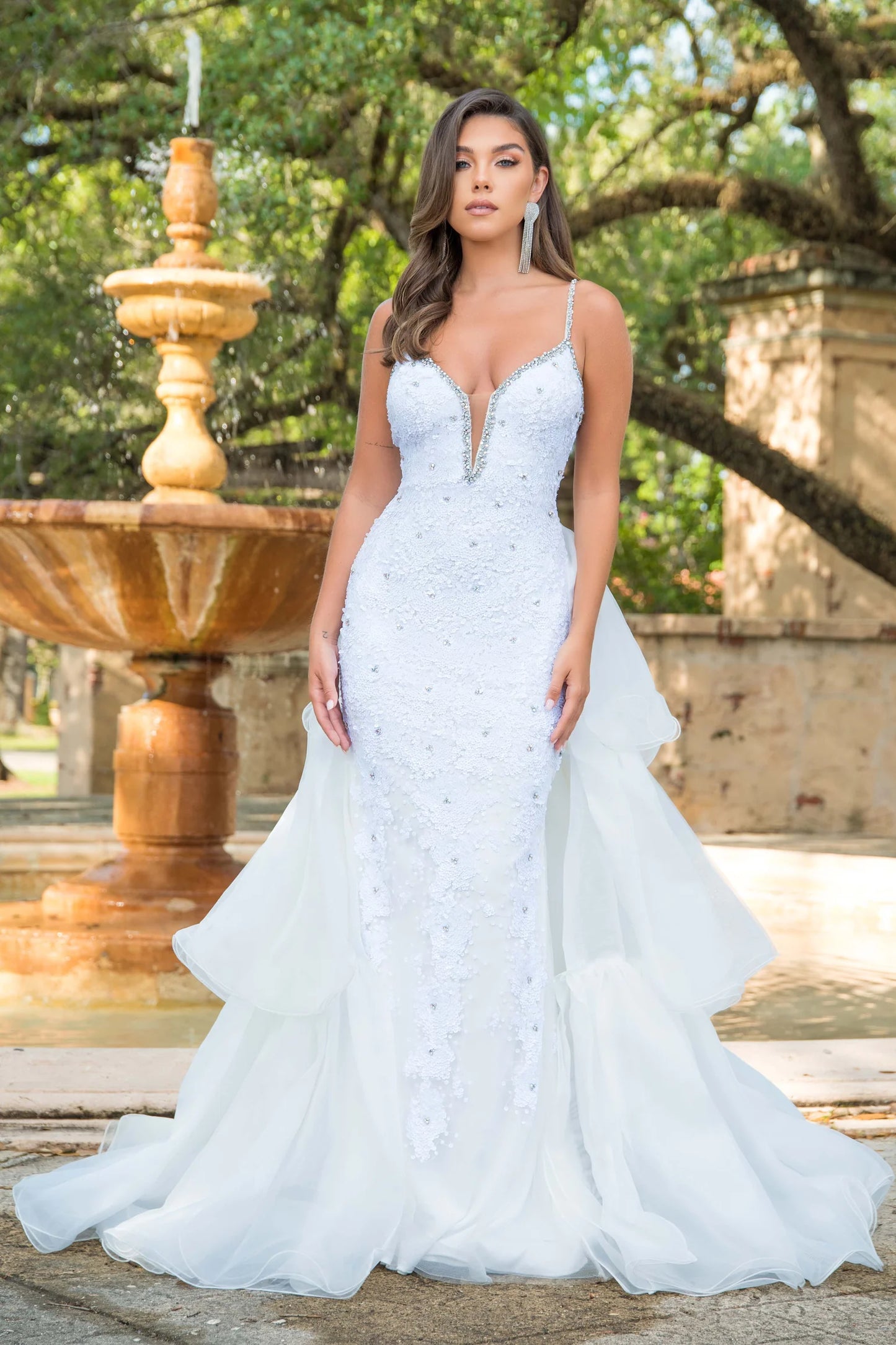 Ava Presley 38813 Long Fitted Beaded Sequin Formal Gown. This Pageant Dress Features a  Layered Overskirt Detachable from the back of this Prom Dress. Plunging V Neckline with embellished straps.  Sizes: 00-24  Colors: White, Red, Hot Pink, Periwinkle, Royal