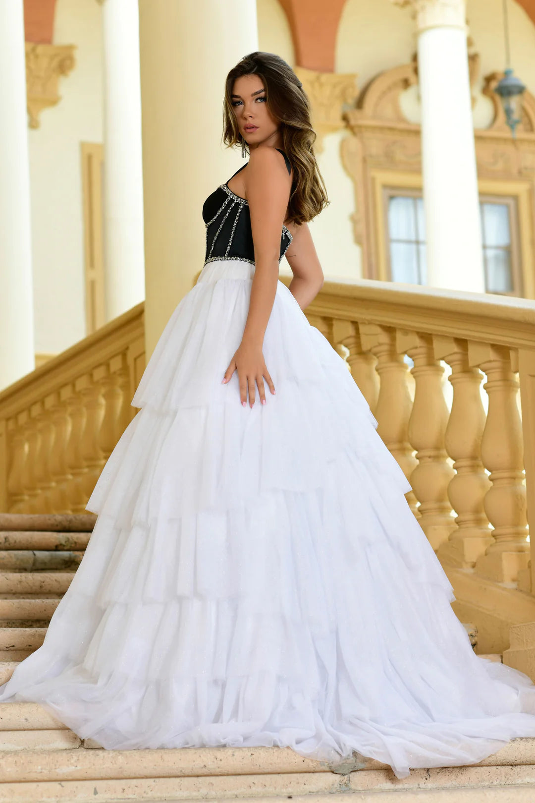 Step out in style with the Ava Presley 28592 Shimmer Tulle A Line Layer Ballgown Prom Dress. This stunning gown features a satin corset and crystal embellishments for a touch of elegance. The A-line silhouette and layered tulle skirt will make you feel like a princess. Perfect for prom or any special occasion.  Sizes: 00-16  Colors: Lilac, Black/White