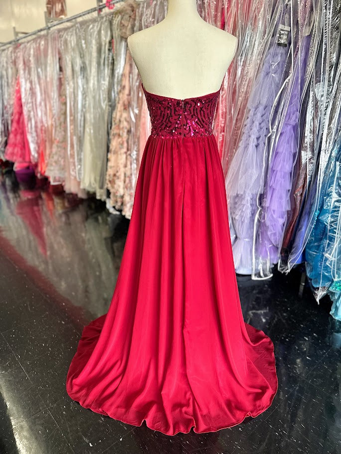 This Envious Couture BM170 dress in size 12 features a sophisticated burgundy hue, perfect for proms and bridesmaid occasions. Crafted from lightweight chiffon, it offers graceful movement and comfort throughout your event. The gown's flattering A-line silhouette and sparkling sequin accents create an elegant and timeless look that enhances your natural shape with subtle shine. Ideal for formal settings, this dress blends refined style with expert design tailored for memorable evenings.

Size: 12

Color: Bu