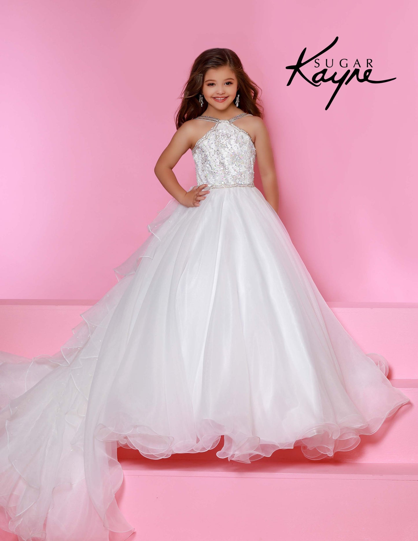 Sugar Kayne C143 Girls and Preteens Pageant Dress.&nbsp; This is a beautiful flowy organza pageant gown with embellished high neckline.&nbsp; This dress features an organza ruffle that flows down the back of the dress.

Colors: &nbsp;Hot Pink, Magenta, Red, Royal, White, Yellow

Sizes:&nbsp; 2-16

(Sizes 2-6 do not have bust cups, Sizes 8-16 will have preteen size bust cups)

Fabric:&nbsp; Satin, Organza, Stretch Lace