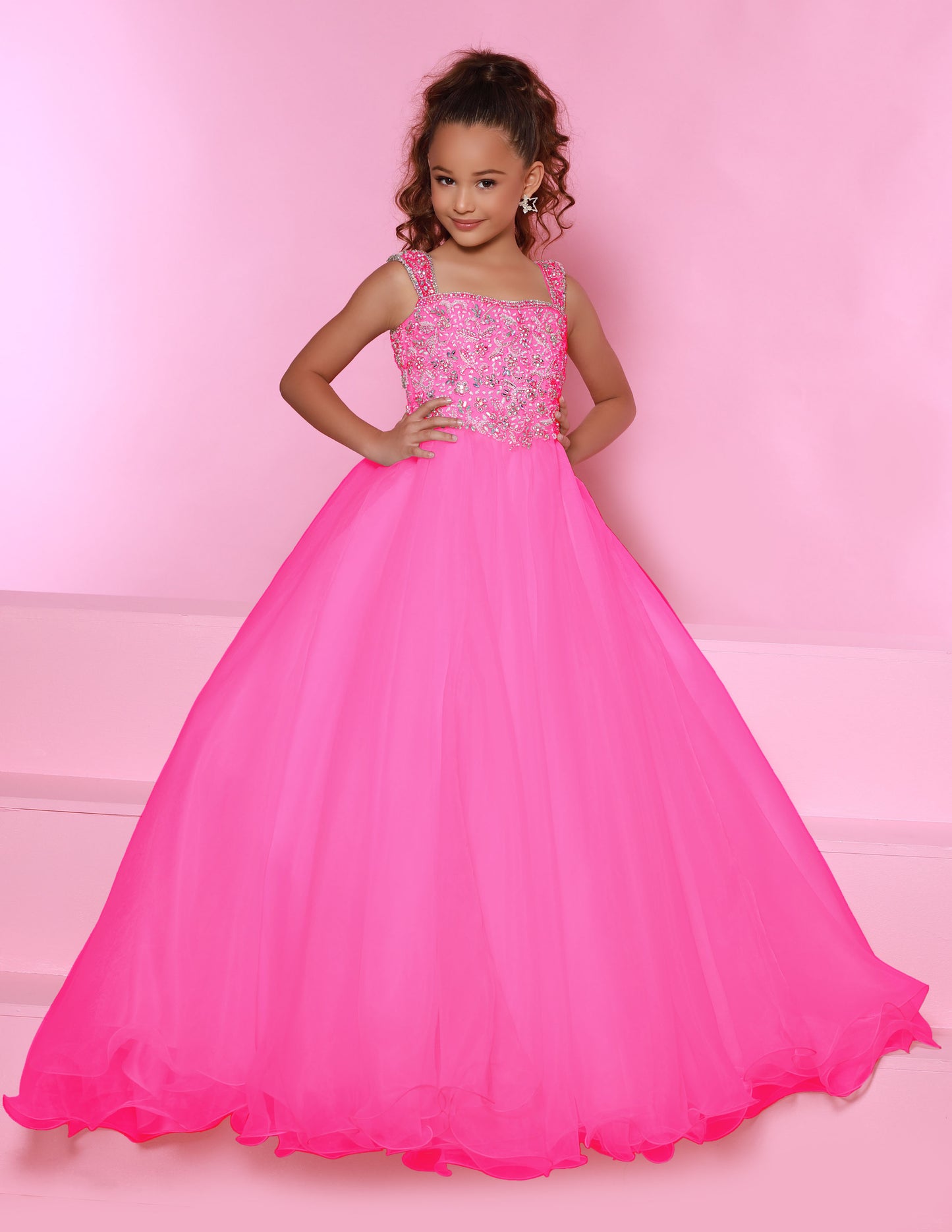 Sugar Kayne C146 Girls Pageant Dress.&nbsp; This lush pageant ballgown is made of flowy organza fabric.&nbsp; The top is embellished with semi sweetheart neckline and cap sleeves.&nbsp; Float on the stage in this full flowy pageant ballgown for girls and preteens.

Colors:&nbsp; Barbie Pink, Orange, Periwinkle, Royal, Turquoise, White

Sizes:&nbsp; 2-16

(Sizes 2-6 do not have bust cups, Sizes 8-16 will have preteen size bust cups)

Fabric:&nbsp; Organza, Mesh, Stretch Lining&nbsp;