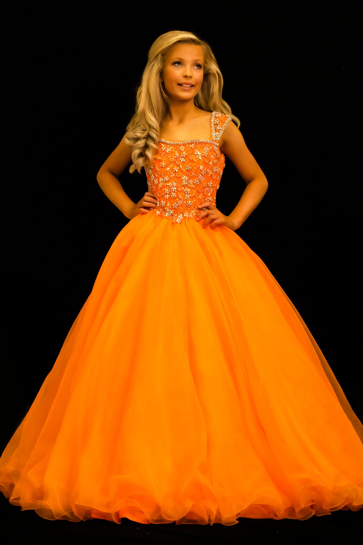 Sugar Kayne C146 Girls Pageant Dress.&nbsp; This lush pageant ballgown is made of flowy organza fabric.&nbsp; The top is embellished with semi sweetheart neckline and cap sleeves.&nbsp; Float on the stage in this full flowy pageant ballgown for girls and preteens.

Colors:&nbsp; Barbie Pink, Orange, Periwinkle, Royal, Turquoise, White

Sizes:&nbsp; 2-16

(Sizes 2-6 do not have bust cups, Sizes 8-16 will have preteen size bust cups)

Fabric:&nbsp; Organza, Mesh, Stretch Lining&nbsp;