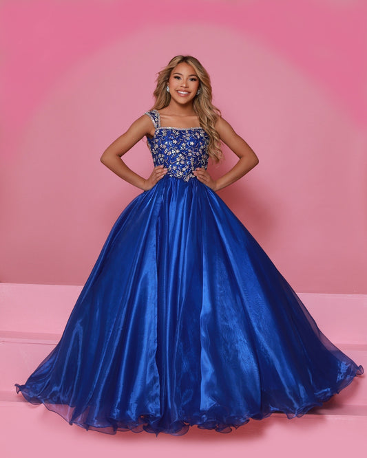 Sugar Kayne C146 Girls Pageant Dress.&nbsp; This lush pageant ballgown is made of flowy organza fabric.&nbsp; The top is embellished with semi sweetheart neckline and cap sleeves.&nbsp; Float on the stage in this full flowy pageant ballgown for girls and preteens.

Colors:&nbsp; Barbie Pink, Orange, Periwinkle, Royal, Turquoise, White

Sizes:&nbsp; 2-16

(Sizes 2-6 do not have bust cups, Sizes 8-16 will have preteen size bust cups)

Fabric:&nbsp; Organza, Mesh, Stretch Lining&nbsp;