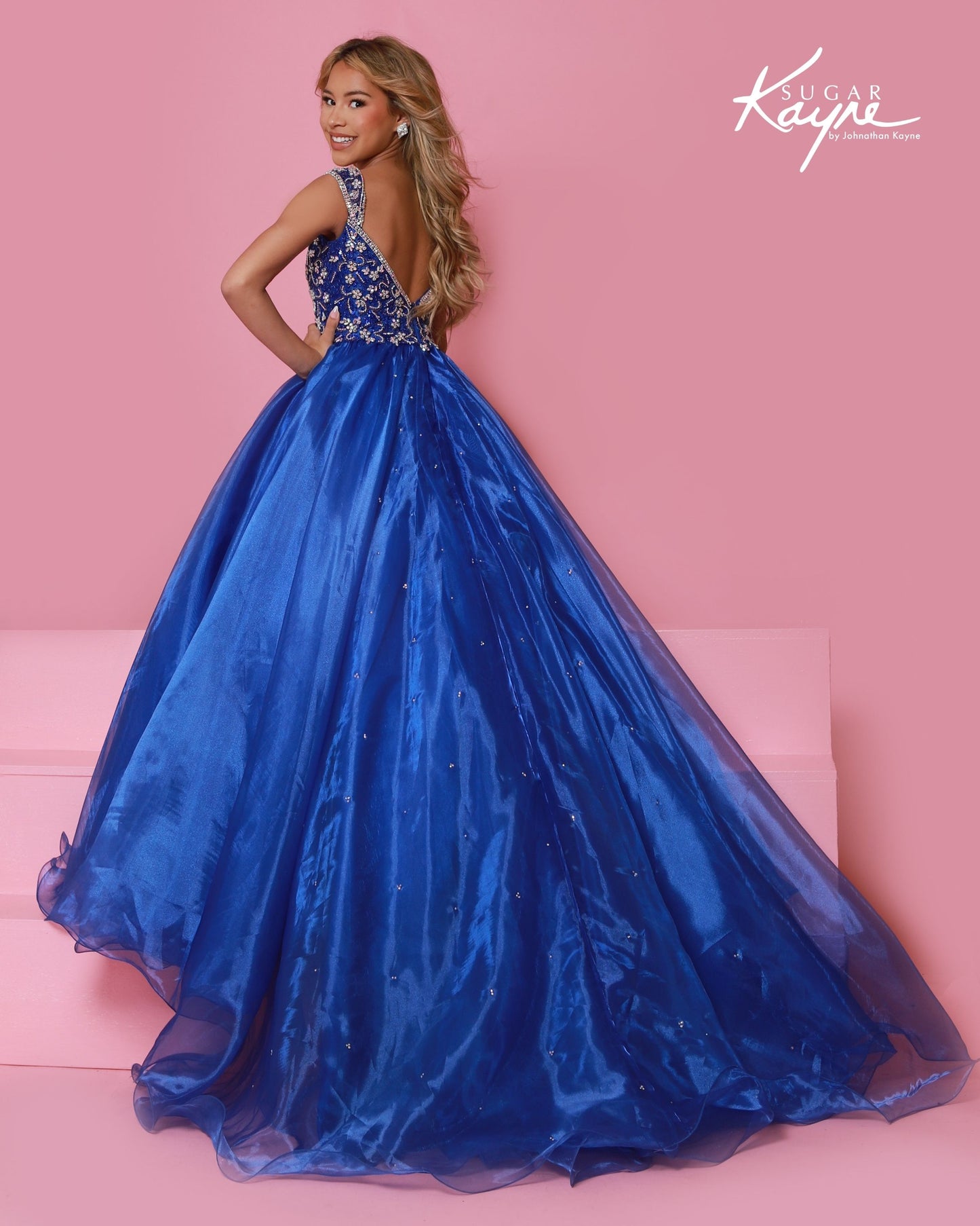 Sugar Kayne C146 Girls Pageant Dress.&nbsp; This lush pageant ballgown is made of flowy organza fabric.&nbsp; The top is embellished with semi sweetheart neckline and cap sleeves.&nbsp; Float on the stage in this full flowy pageant ballgown for girls and preteens.

Colors:&nbsp; Barbie Pink, Orange, Periwinkle, Royal, Turquoise, White

Sizes:&nbsp; 2-16

(Sizes 2-6 do not have bust cups, Sizes 8-16 will have preteen size bust cups)

Fabric:&nbsp; Organza, Mesh, Stretch Lining&nbsp;