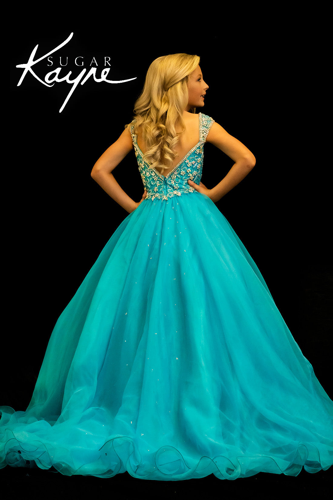 Sugar Kayne C146 Girls Pageant Dress.&nbsp; This lush pageant ballgown is made of flowy organza fabric.&nbsp; The top is embellished with semi sweetheart neckline and cap sleeves.&nbsp; Float on the stage in this full flowy pageant ballgown for girls and preteens.

Colors:&nbsp; Barbie Pink, Orange, Periwinkle, Royal, Turquoise, White

Sizes:&nbsp; 2-16

(Sizes 2-6 do not have bust cups, Sizes 8-16 will have preteen size bust cups)

Fabric:&nbsp; Organza, Mesh, Stretch Lining&nbsp;