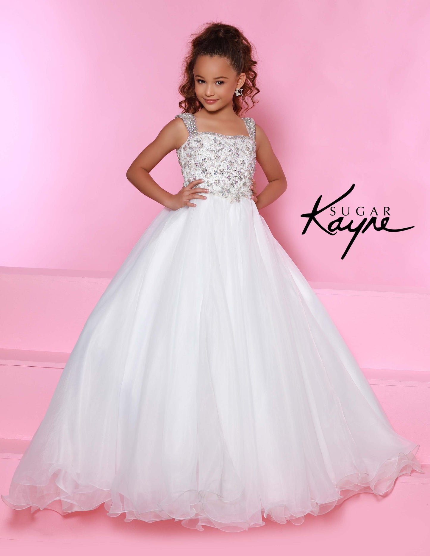 Sugar Kayne C146 Girls Pageant Dress.&nbsp; This lush pageant ballgown is made of flowy organza fabric.&nbsp; The top is embellished with semi sweetheart neckline and cap sleeves.&nbsp; Float on the stage in this full flowy pageant ballgown for girls and preteens.

Colors:&nbsp; Barbie Pink, Orange, Periwinkle, Royal, Turquoise, White

Sizes:&nbsp; 2-16

(Sizes 2-6 do not have bust cups, Sizes 8-16 will have preteen size bust cups)

Fabric:&nbsp; Organza, Mesh, Stretch Lining&nbsp;