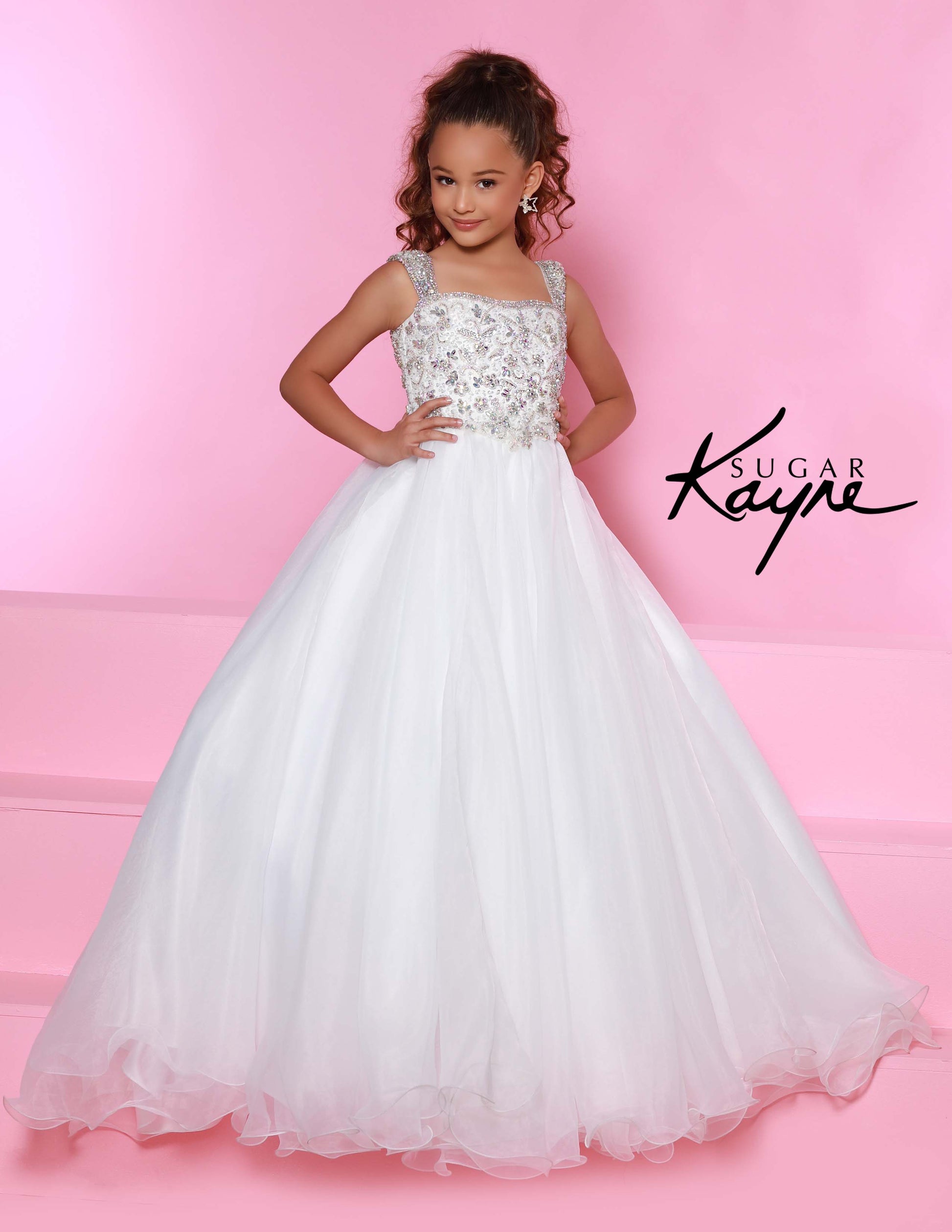 Sugar Kayne C146 Girls Pageant Dress.&nbsp; This lush pageant ballgown is made of flowy organza fabric.&nbsp; The top is embellished with semi sweetheart neckline and cap sleeves.&nbsp; Float on the stage in this full flowy pageant ballgown for girls and preteens.

Colors:&nbsp; Barbie Pink, Orange, Periwinkle, Royal, Turquoise, White

Sizes:&nbsp; 2-16

(Sizes 2-6 do not have bust cups, Sizes 8-16 will have preteen size bust cups)

Fabric:&nbsp; Organza, Mesh, Stretch Lining&nbsp;