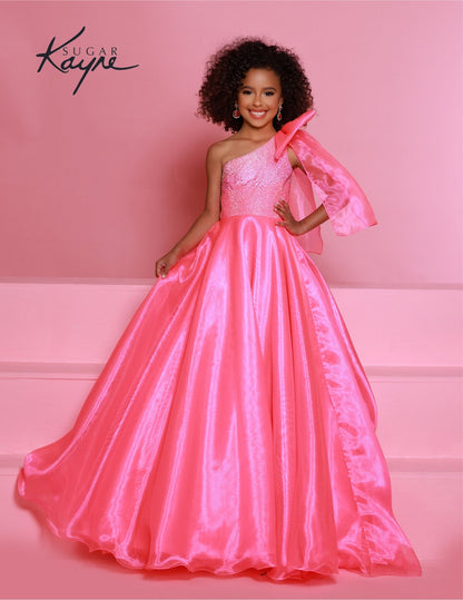 Sugar Kayne C310 Girls and Preteens One Shoulder bodice with a Bow on the shoulder A Line Shimmer Pageant Dress Crystal Gown&nbsp;
Go ahead and take a BOW in this lovely one-shoulder organza ballgown. The ombre beaded bodice brings all the dazzle!

Colors:
Orange, Yellow, Blue, White, Neon Pink

Sizes:
2, 4, 6, 8, 10, 12, 14, 16

Fabric Organza, Mesh, Satin Lining

(Sizes 2-6 do not have bust cups, Sizes 8-16 will have preteen size bust cups)