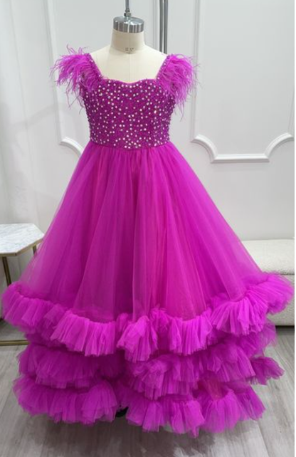 Sugar Kayne C327 features a fashionable pageant dress for girls and preteens, complete with feather straps, a tiered ruffle bottom, and a crystal stone bodice.&nbsp;Stand out and feel confident on stage! This tulle ballgown features ostrich feathers on the shoulders, a beaded bodice, and tiered skirt to show off your personality!

Colors:&nbsp; Aqua, Bubblegum, White, Magenta

Sizes:&nbsp;&nbsp;2, 4, 6, 8, 10, 12, 14, 16

(Sizes 2-6 do not have bust cups, Sizes 8-16 will have preteen size bust cups)