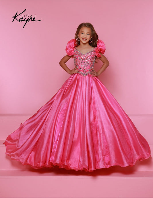 Bring out her inner beauty with this Sugar Kayne C334 Girls Pageant Dress. This luxurious dress is made from iridescent organza and features a sweetheart neckline and long ball gown skirt. Perfect for any special occasion.&nbsp;Transform into a twinkling starlet with this Metallic Organza Gown. The beaded bodice adds a touch of sparkle to this enchanting ensemble. The delicate ruffle sleeves create a charming look!

Color:&nbsp;Hot Pink Multi, Mint Multi, White Multi, Purple Multi

Size:&nbsp;2, 4, 6, 8, 10
