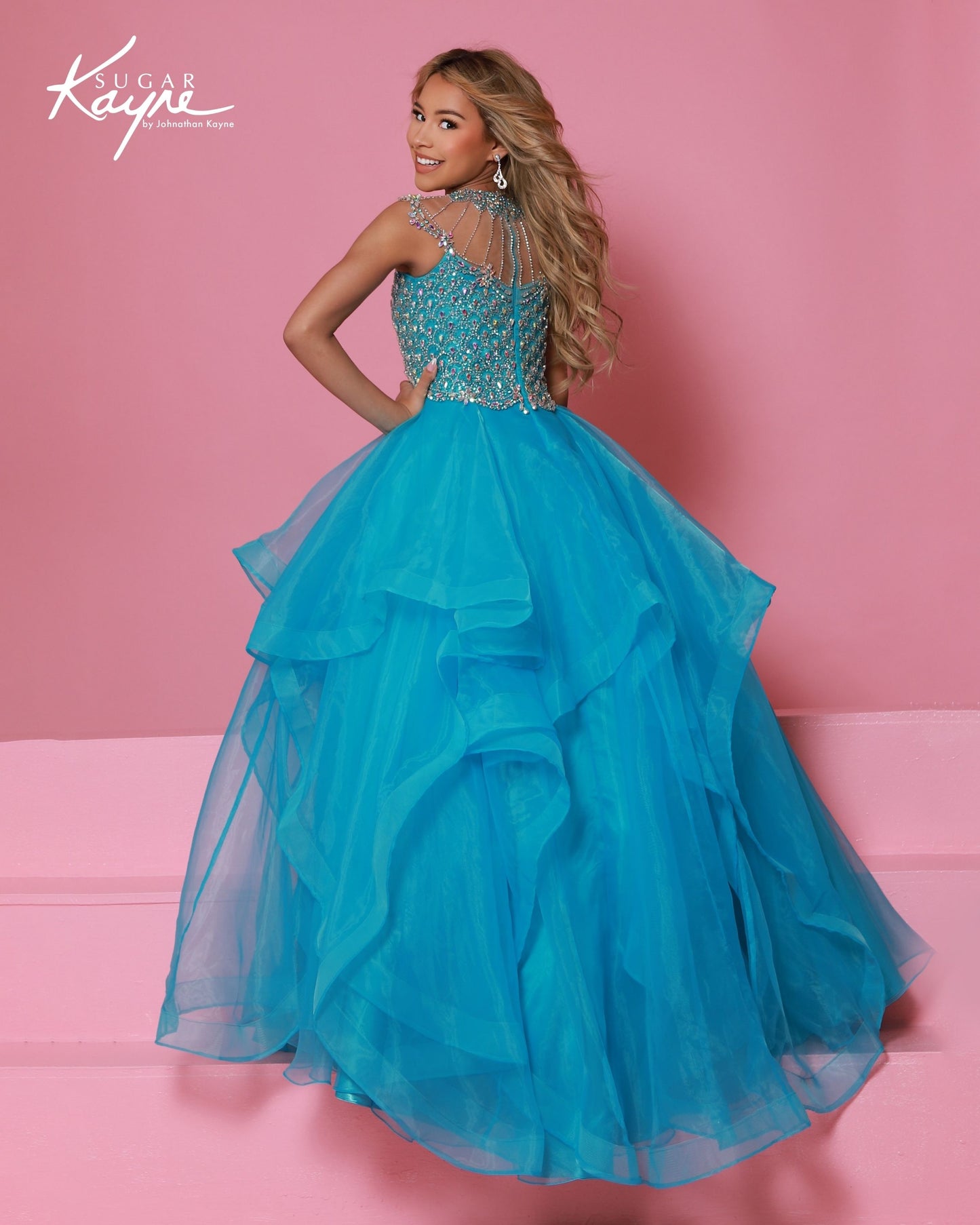 Sugar Kayne C354&nbsp; This high-quality girls' pageant ballgown from Sugar Kayne boasts an embellished bodice, a high crystal neckline, and a layered organza long skirt with horsehair trim. Perfect for making a statement on stage, this dress exudes elegance and sophistication. Walk with confidence and grace in this stunning piece.

Colors:&nbsp; Barbie Pink, Daffodil, Jade, Turquoise

Sizes:&nbsp; 2-16