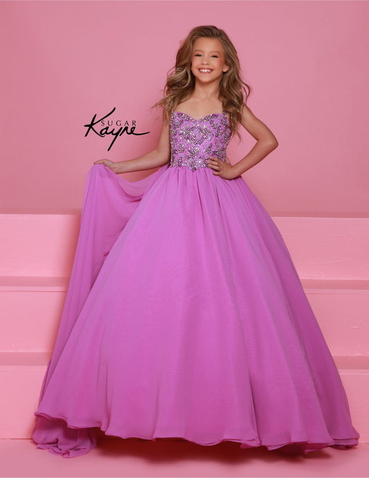 Experience the epitome of grace and sophistication with the Sugar Kayne C368 Chiffon Cape Girls Pageant Dress. Adorned with delicate crystal sequins and a stunning bodice, this ballgown is sure to make a lasting impression. The chiffon cape adds a touch of elegance and the perfect finishing touch. Perfect for teenagers looking for a show-stopping dress. Be simply stunning at your next pageant in this exquisite poly chiffon dress. Designed with beaded straps and a bodice that exudes winner-worthy elegance, i