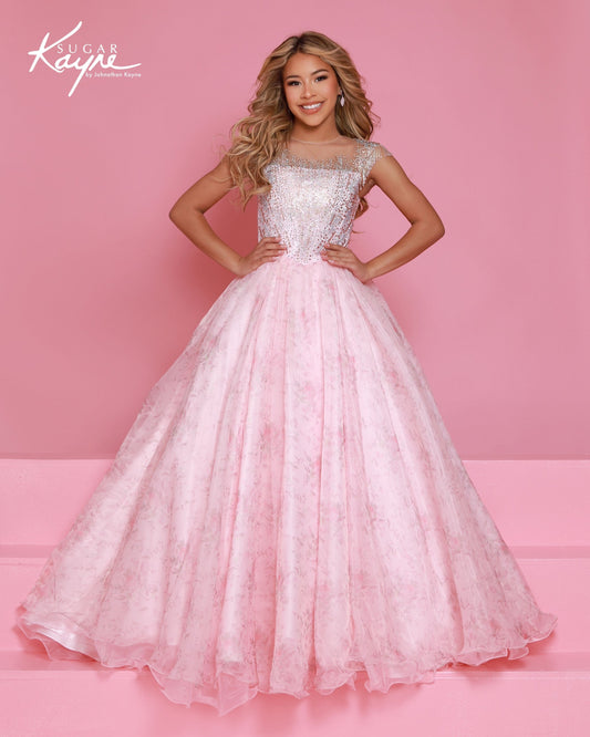 Designer: Sugar Kayne — Style C406
Sugar Kayne style C406 is a classic girls pageant dress with layered organza and a smooth satin lining for beautiful volume and shine. The full skirt and refined bodice give this gown timeless pageant appeal, making it ideal for everything from local titles to national stages.

Sizes: 2–16
Colors: Blush, Blue