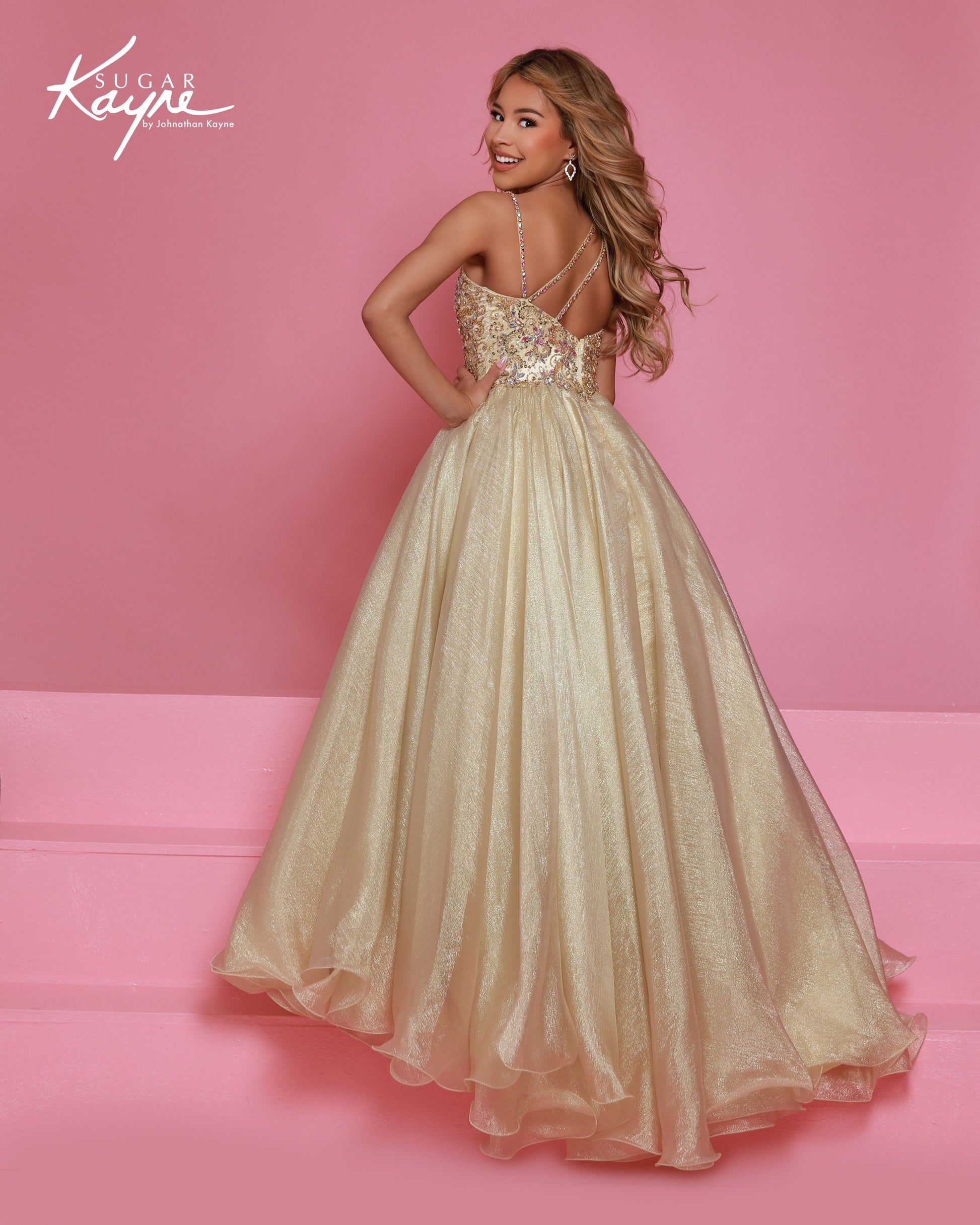 Designer: Sugar Kayne — Style C407
Sugar Kayne style C407 is a classic girls pageant dress with layered organza and a smooth satin lining for beautiful volume and shine. The full skirt and refined bodice give this gown timeless pageant appeal, making it ideal for everything from local titles to national stages.

Sizes: 2–16
Colors: Gold, Turquoise