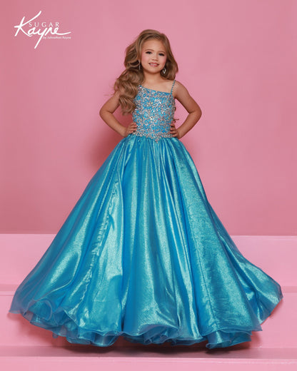 Designer: Sugar Kayne — Style C407
Sugar Kayne style C407 is a classic girls pageant dress with layered organza and a smooth satin lining for beautiful volume and shine. The full skirt and refined bodice give this gown timeless pageant appeal, making it ideal for everything from local titles to national stages.

Sizes: 2–16
Colors: Gold, Turquoise