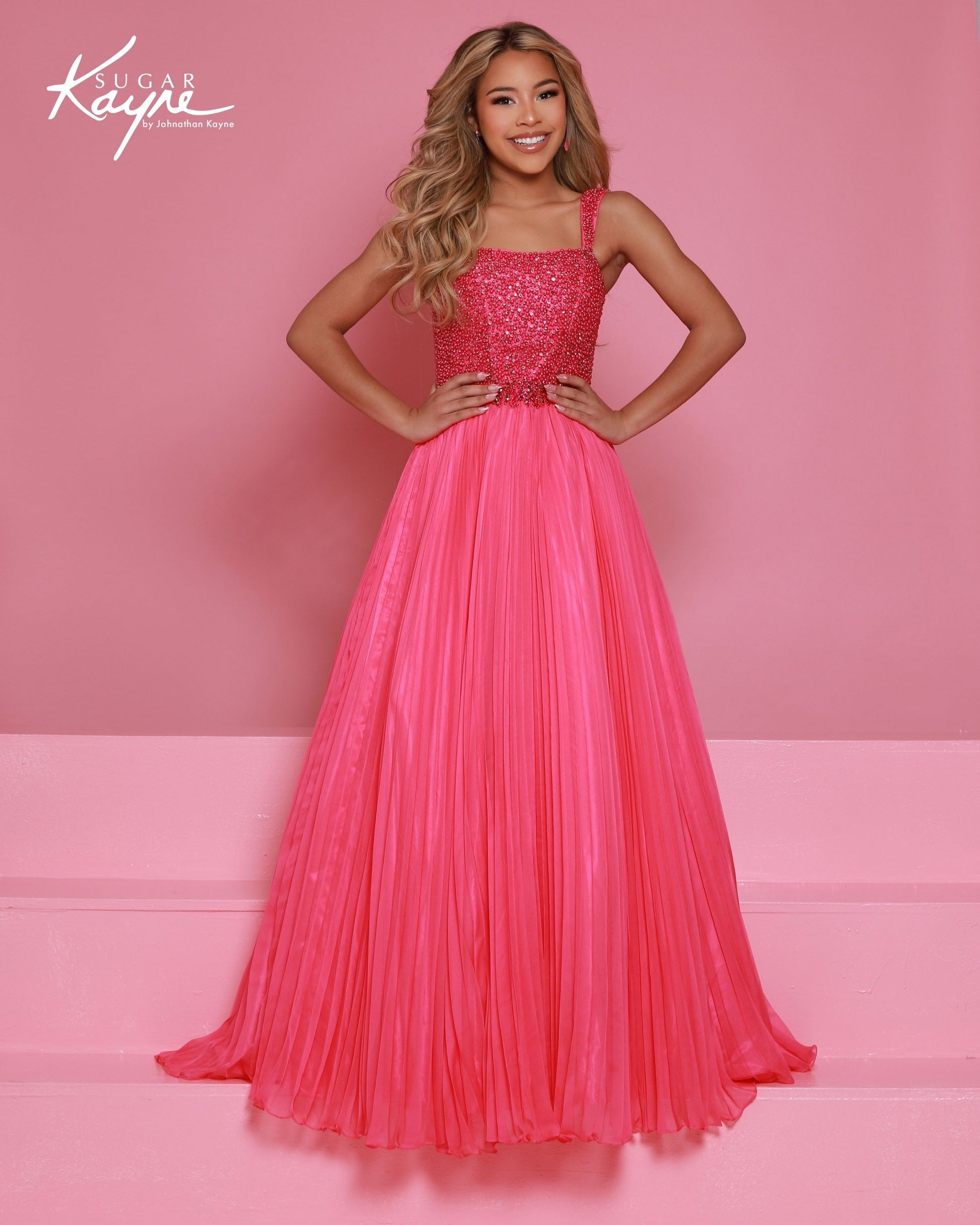 Designer: Sugar Kayne — Style C408
This lightweight Sugar Kayne girls pageant dress, style C408, showcases flowing chiffon over a satin lining for effortless drape and motion. The look is soft, feminine, and comfortable, giving her a confident presence from interview to evening wear on the pageant stage.

Sizes: 2–16
Colors: Hot Pink, Turquoise, White