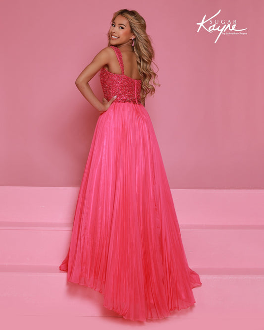 Designer: Sugar Kayne — Style C408
This lightweight Sugar Kayne girls pageant dress, style C408, showcases flowing chiffon over a satin lining for effortless drape and motion. The look is soft, feminine, and comfortable, giving her a confident presence from interview to evening wear on the pageant stage.

Sizes: 2–16
Colors: Hot Pink, Turquoise, White