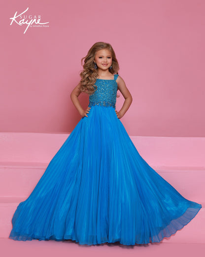 Designer: Sugar Kayne — Style C408
This lightweight Sugar Kayne girls pageant dress, style C408, showcases flowing chiffon over a satin lining for effortless drape and motion. The look is soft, feminine, and comfortable, giving her a confident presence from interview to evening wear on the pageant stage.

Sizes: 2–16
Colors: Hot Pink, Turquoise, White