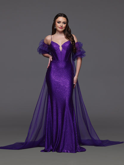 Elevate your prom look with the Candice Wang 72521 dress. This glittery fitted dress features a detachable puff sleeve cape for added drama. Stand out in style and comfort with the perfect fit and eye-catching design. Step out confidently and make a statement at your special event.

Size: 8

Color: Purple