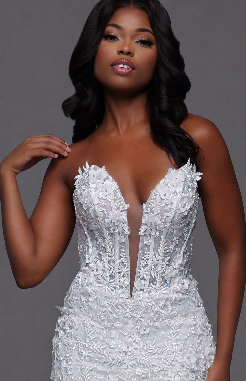 Stunning white lace prom dress by Candice Wang featuring an elegant mermaid silhouette. This show-stopping gown showcases a sheer sequin corset bodice with a daring plunging neckline that commands attention. The intricate lace detailing and fitted mermaid cut create a glamorous, sophisticated look perfect for prom night. Make an unforgettable entrance in this breathtaking formal wear.

Size: 2

Color: White