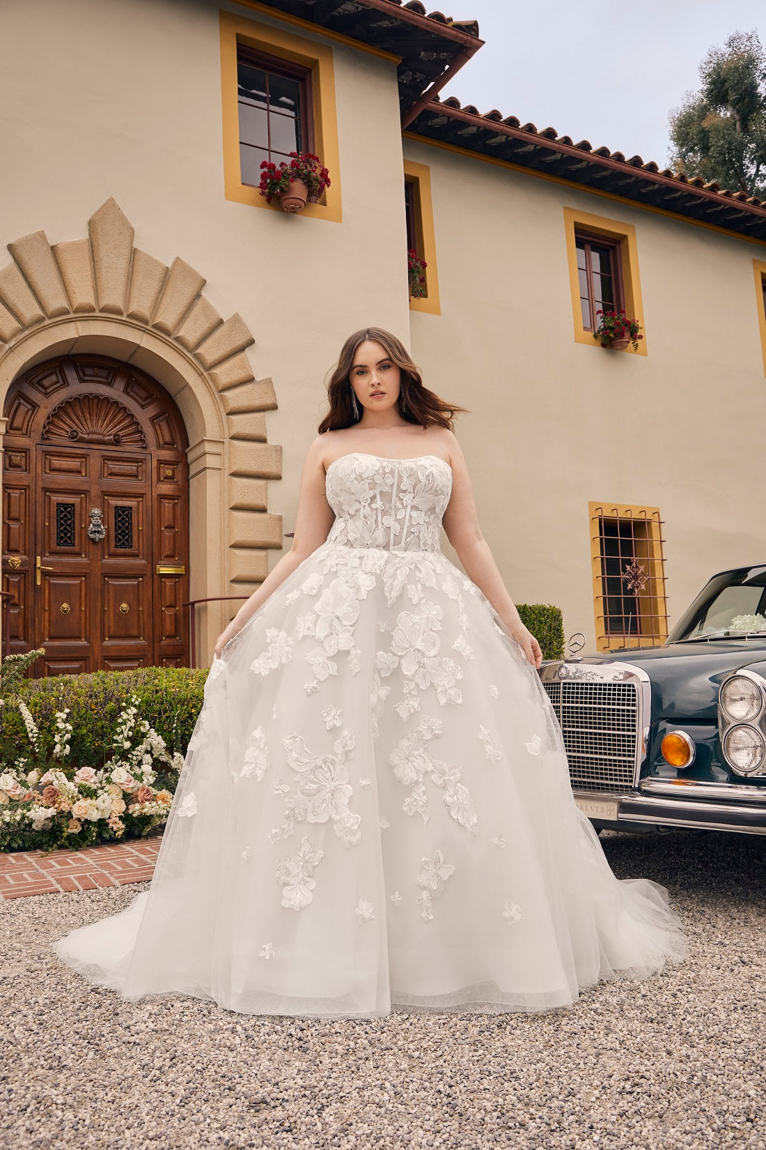 Casablanca Bridal 2540C Elloise A-Line Ballgown Strapless Sheer Floral Corset Sweetheart Neckline Open Back Train Wedding Gown. Prepare to be swept away by the ethereal beauty of Style 2540 Elloise, our exquisite A-line wedding dress. Plus sized