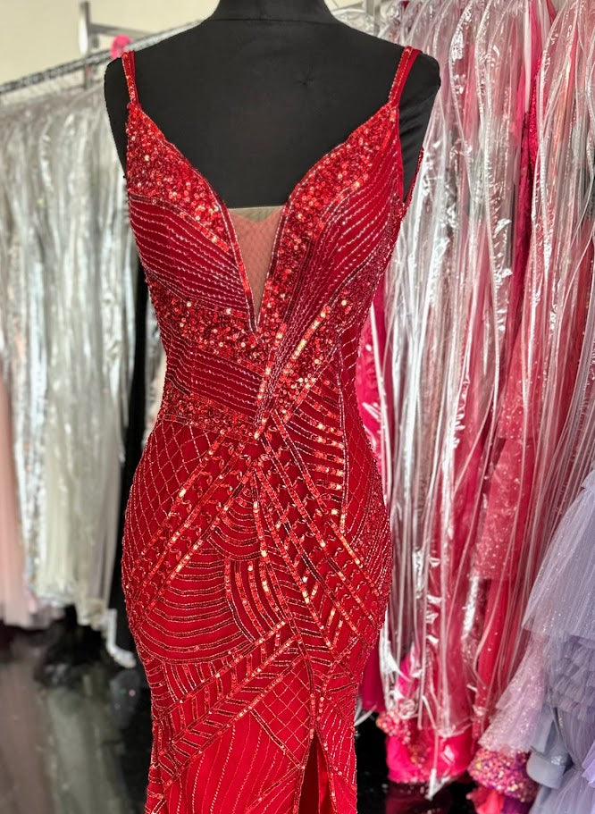 Elevate your formal occasion with the Chic and Holland AR330375 prom dress in vibrant red. This size 2 gown is adorned with intricate beadwork and shimmering sequins, creating an elegant, eye-catching silhouette. The deep V neckline and high slit skirt add a sophisticated allure, balancing modern style with timeless grace. Perfect for pageants or special events, this dress ensures you stand out with refined glamour and confident poise.

Size: 2

Color: Red