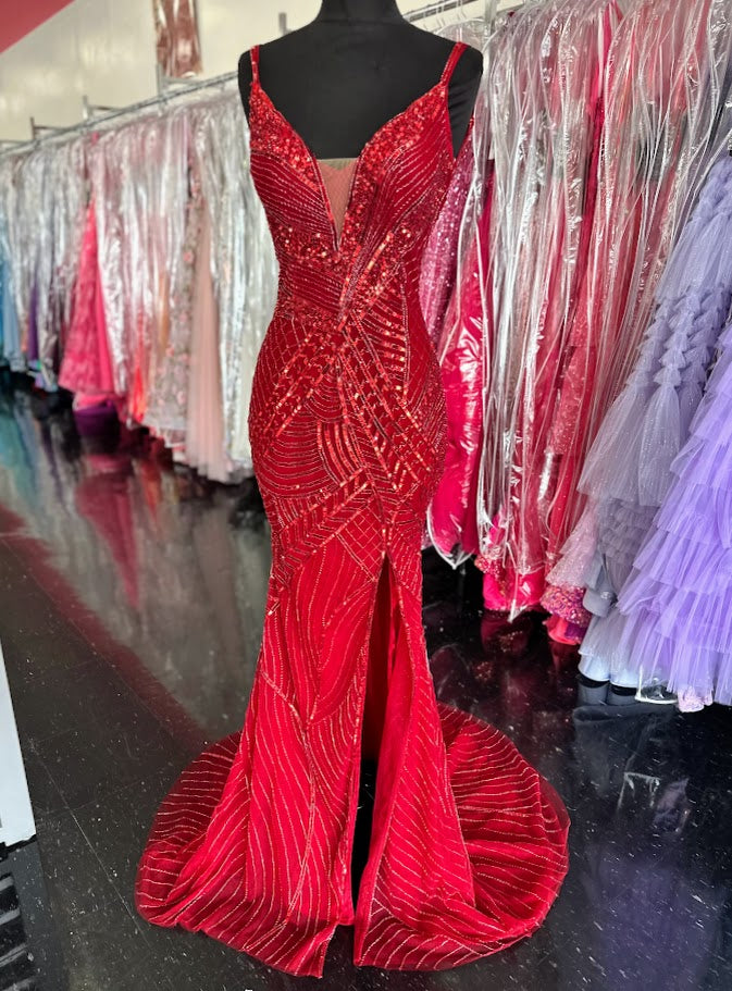 Elevate your formal occasion with the Chic and Holland AR330375 prom dress in vibrant red. This size 2 gown is adorned with intricate beadwork and shimmering sequins, creating an elegant, eye-catching silhouette. The deep V neckline and high slit skirt add a sophisticated allure, balancing modern style with timeless grace. Perfect for pageants or special events, this dress ensures you stand out with refined glamour and confident poise.

Size: 2

Color: Red