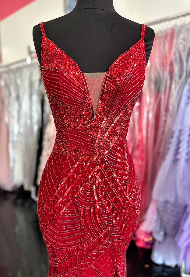 Elevate your formal occasion with the Chic and Holland AR330375 prom dress in vibrant red. This size 2 gown is adorned with intricate beadwork and shimmering sequins, creating an elegant, eye-catching silhouette. The deep V neckline and high slit skirt add a sophisticated allure, balancing modern style with timeless grace. Perfect for pageants or special events, this dress ensures you stand out with refined glamour and confident poise.

Size: 2

Color: Red