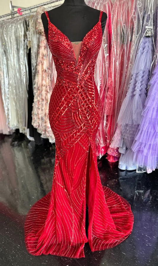 Elevate your formal occasion with the Chic and Holland AR330375 prom dress in vibrant red. This size 2 gown is adorned with intricate beadwork and shimmering sequins, creating an elegant, eye-catching silhouette. The deep V neckline and high slit skirt add a sophisticated allure, balancing modern style with timeless grace. Perfect for pageants or special events, this dress ensures you stand out with refined glamour and confident poise.

Size: 2

Color: Red