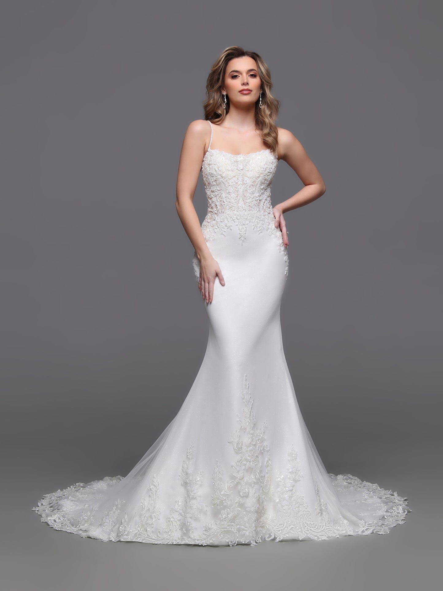 Elevate your bridal elegance with the Davinci Bridal 50880 gown, featuring delicate ivory beaded lace overlay on soft tulle. This size 2 dress showcases a graceful scoop neckline and refined button detailing along the back, blending timeless sophistication with modern charm. Perfect for the bride seeking understated luxury and intricate craftsmanship on her special day.

Fabric:&nbsp;Lace, Tulle

Neckline:&nbsp;Straight Across, Straps

Silhouette:&nbsp;Fit &amp; Flare

Details:&nbsp;Beading, Buttons, Chapel