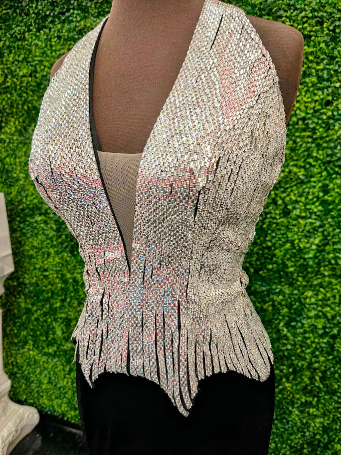 Elevate your formal wardrobe with the Johnathan Kayne 2534 gown, expertly crafted in rich black velvet. This size 4 dress features a crystal-embellished bodice that adds refined sparkle, while the halter corset design offers structured support and a flattering silhouette. The long fitted skirt includes a tasteful slit, combining elegance with a touch of allure—ideal for pageants or upscale events. This gown balances sophistication and glamour, ensuring you make a confident statement at any special occasion.