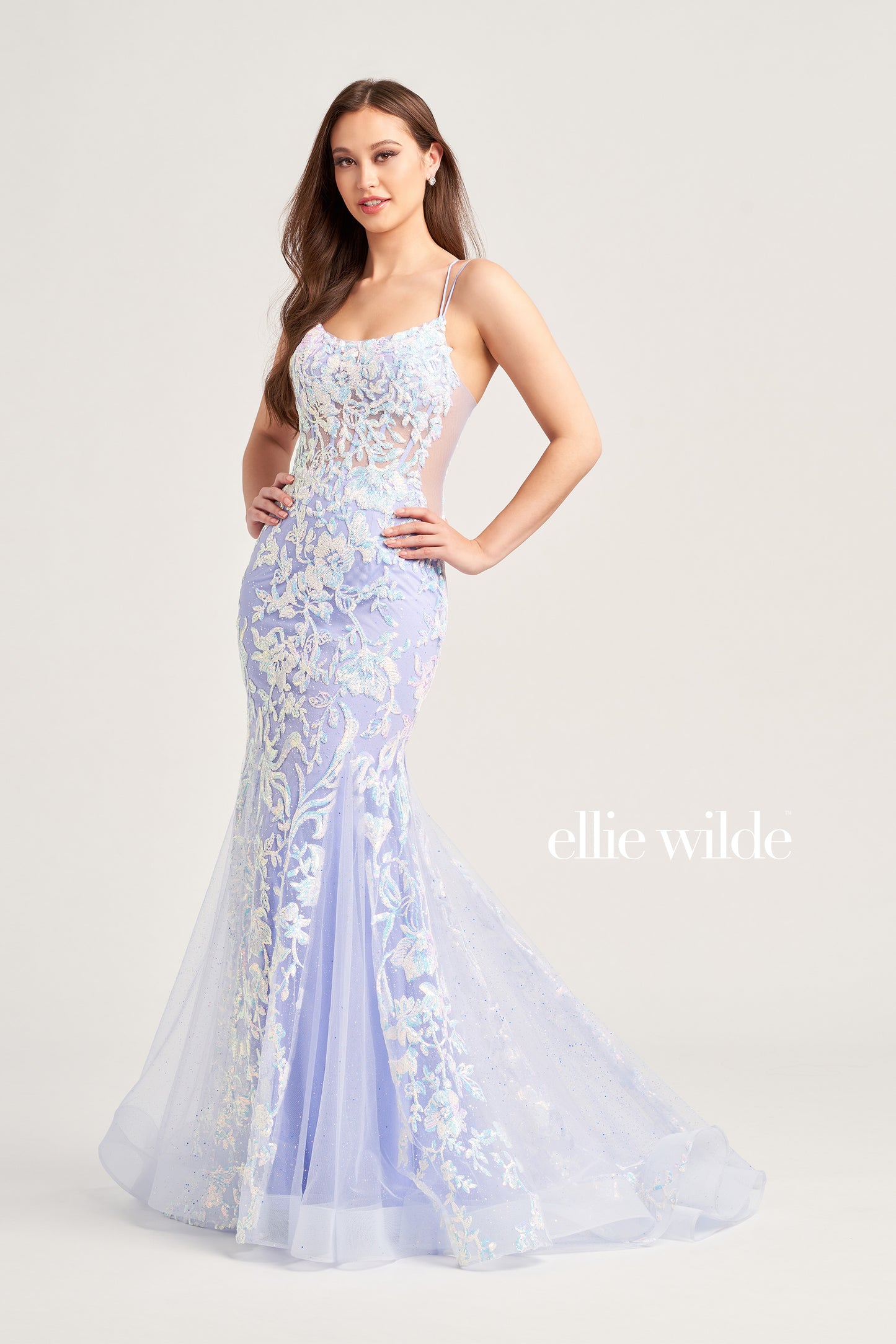 Show up in style with the Ellie Wilde EW35008 Long Sequin Shimmer Mermaid Prom Dress. Made with Glitter Sequin Tulle, this elegant gown has a Scoop Neckline, Sleeveless sleeves, Lace-Up back, and a Natural Waistline. Experience maximum comfort with the Side Waist Mesh Inset and Mermaid silhouette. Show off your curves in this figure-hugging dress!  COLOR: ORANGE, MAGENTA, ULTRA VIOLET, PERIWINKLE/OPAL SIZE: 00 - 20