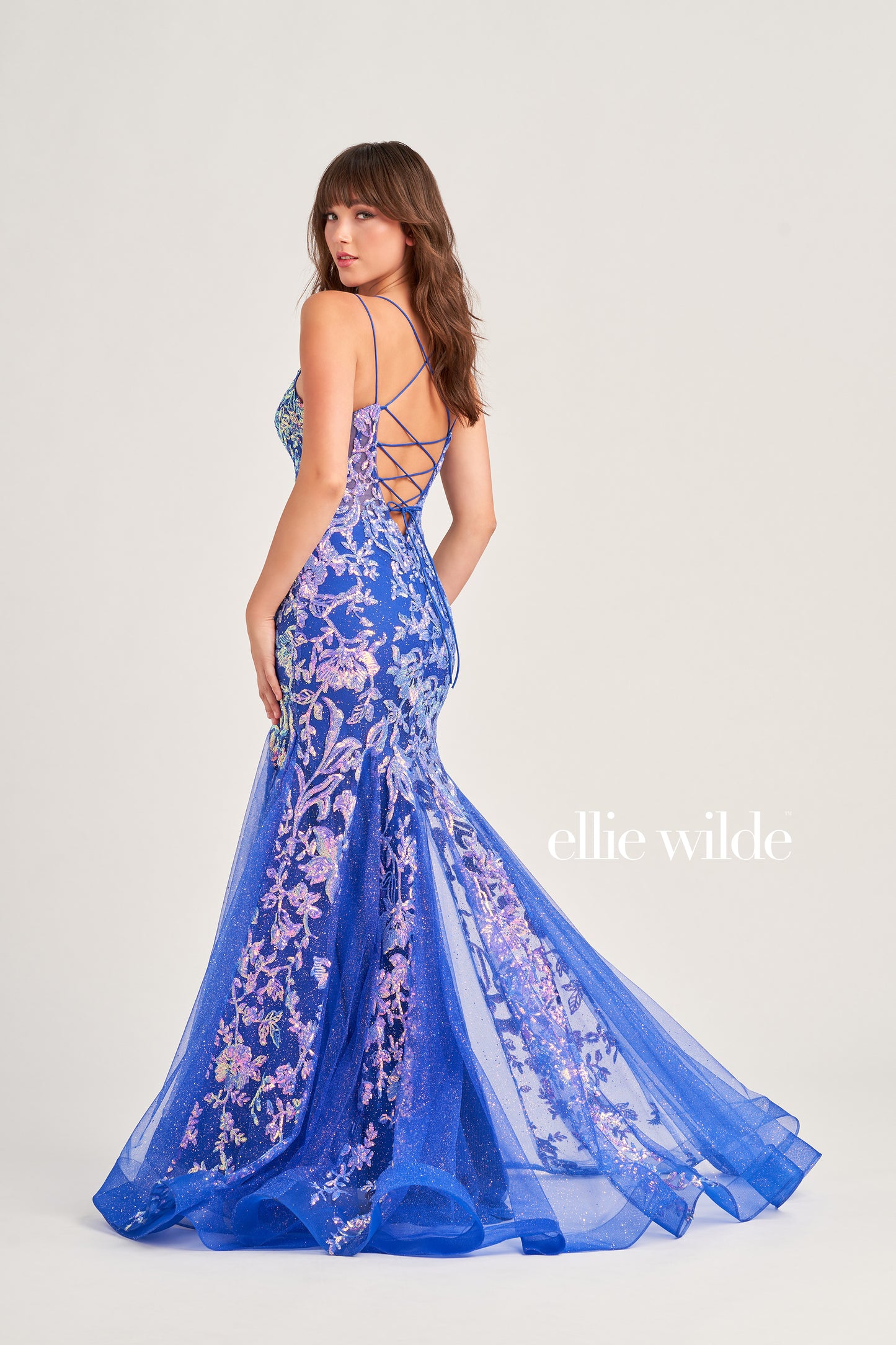 Show up in style with the Ellie Wilde EW35008 Long Sequin Shimmer Mermaid Prom Dress. Made with Glitter Sequin Tulle, this elegant gown has a Scoop Neckline, Sleeveless sleeves, Lace-Up back, and a Natural Waistline. Experience maximum comfort with the Side Waist Mesh Inset and Mermaid silhouette. Show off your curves in this figure-hugging dress!  COLOR: ORANGE, MAGENTA, ULTRA VIOLET, PERIWINKLE/OPAL SIZE: 00 - 20