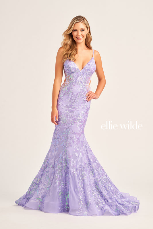 The Ellie Wilde EW35011 Long Mermaid Prom Dress features an eye-catching sequin tulle fabric, a flattering V-neckline, and a unique side waist cut out for a figure-hugging, yet comfortable fit. This gown also includes a lace-up back and a natural waistline for a dazzling and memorable look.  COLOR: BLACK, RED, LIGHT BLUE, EMERALD, LAVENDER, HOT PINK, DUSK, CERULEAN BLUE SIZE: 00 - 16