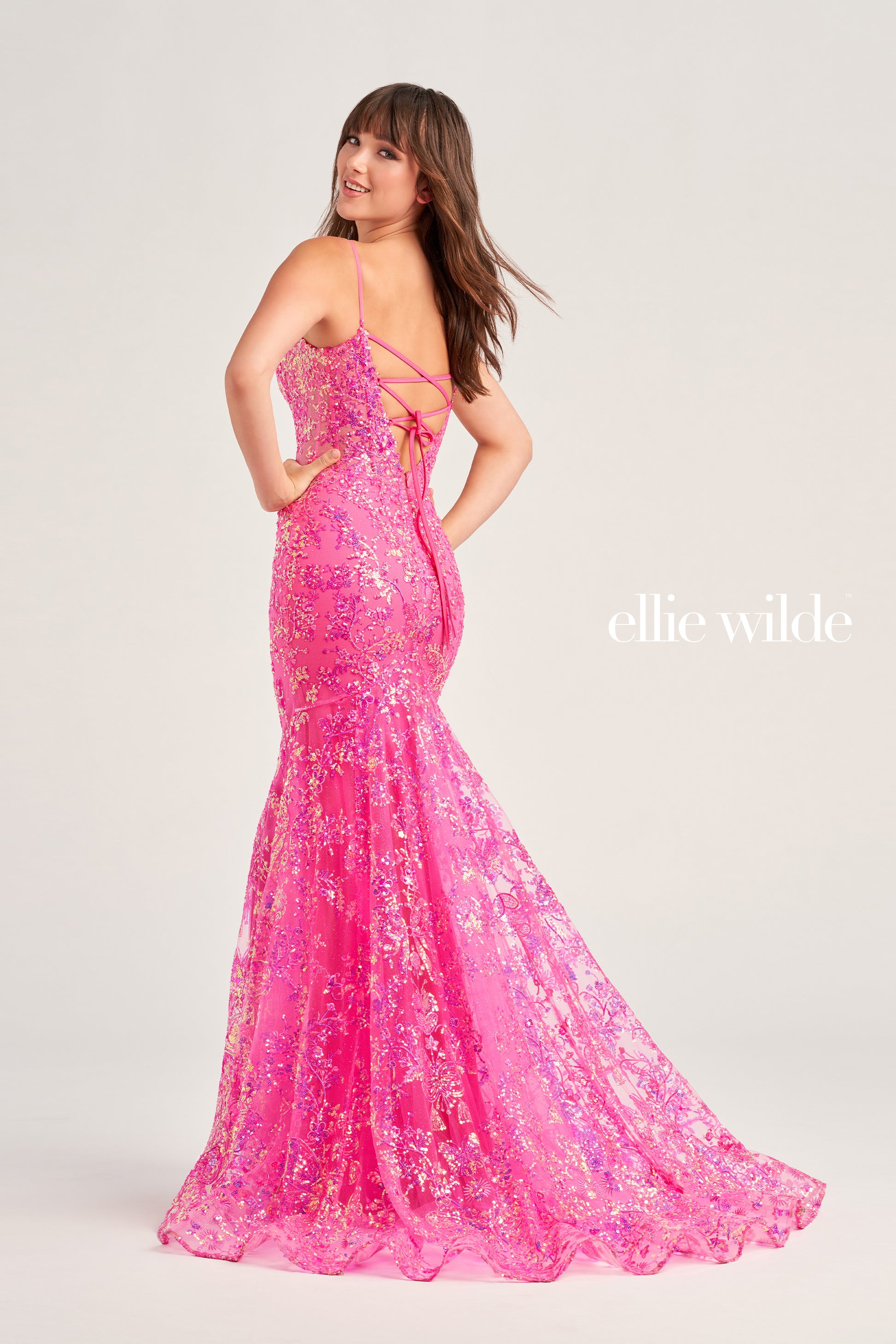 Make a stunning appearance at your next formal event in this Ellie Wilde EW35013 Long Fitted Sequin Mermaid Prom Dress. Crafted from an exquisite combination of Embroidered Tulle, Glitter Tulle, and Sequins, this beautiful dress includes a plunging Sweetheart neckline, a corset bodice with a lace-up back, and a trumpet silhouette for the perfect fit. The Natural waistline and Sleeveless design complete the look.  COLOR: BLACK, MIDNIGHT, LIGHT BLUE, LILAC, HOT PINK SIZE: 00 - 20