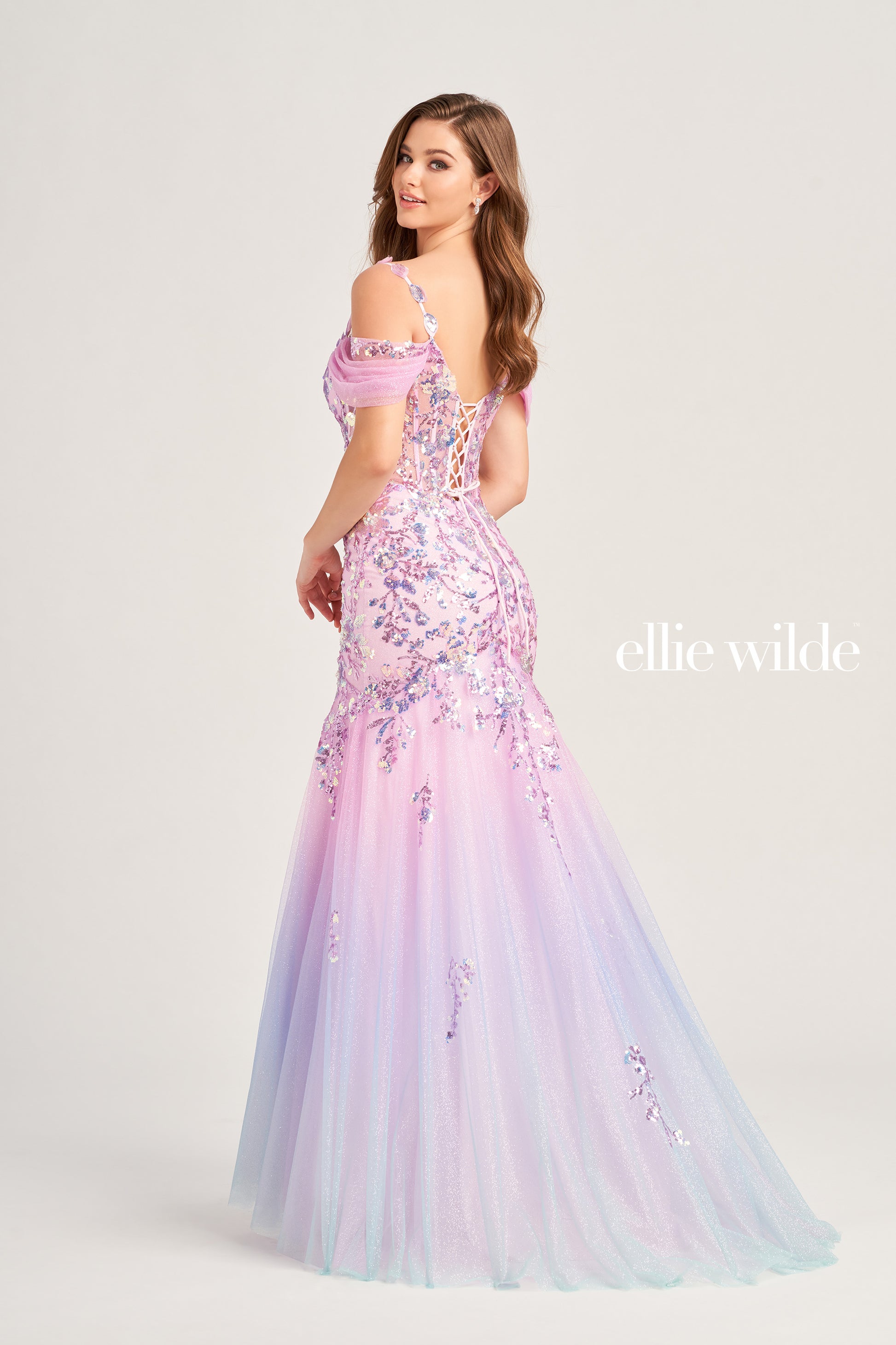The Ellie Wilde EW35056 Ombre Sequin Sheer Corset Prom Dress will make a show-stopping entrance. It features a corset bodice, detachable off-shoulder glitter tulle straps, and a lace-up back for a custom fit. The mermaid silhouette and ombre sequin sheer fabric guarantee a glamorous look on your special night.  COLOR: COTTON CANDY, LIME SORBET, SEA BREEZE SIZE: 00 - 20