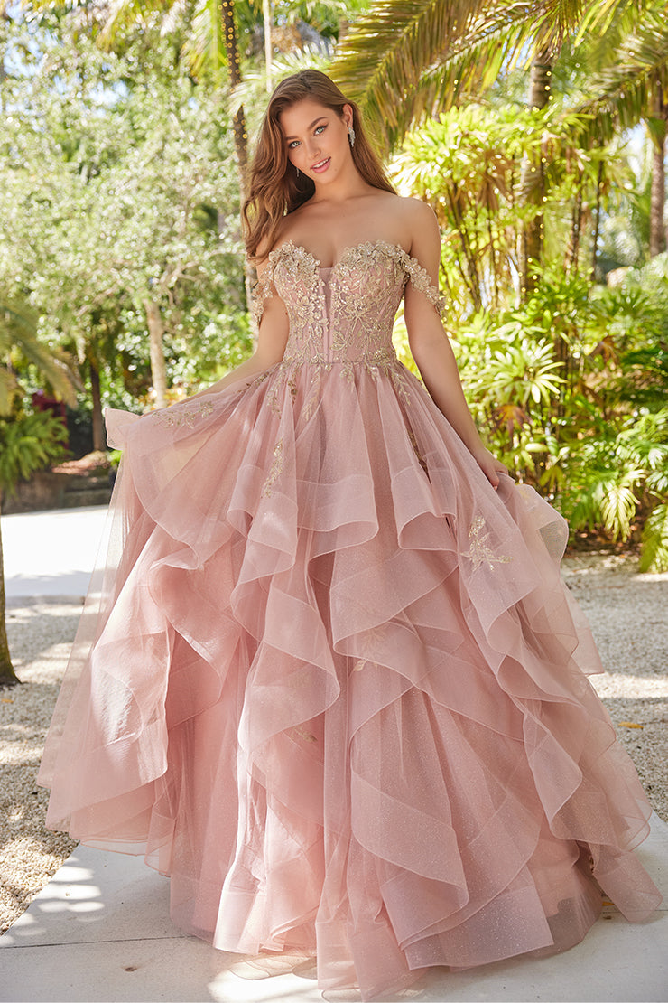 Make a statement in the Ellie Wilde EW35084 prom dress. Featuring an off-the-shoulder top, shimmer sequin lace and ruffle detail, the dress offers a timeless and sophisticated look perfect for the big night. Keep it classic in this classic formal gown.

Sizes: 00-24

Colors: Bluebell, Diamond White, Dusty Rose/Gold, Emerald, Hot Pink, Lavender, Light Pink, Light Yellow, Navy, Red, Royal, Silver, Teal, Wine&nbsp;