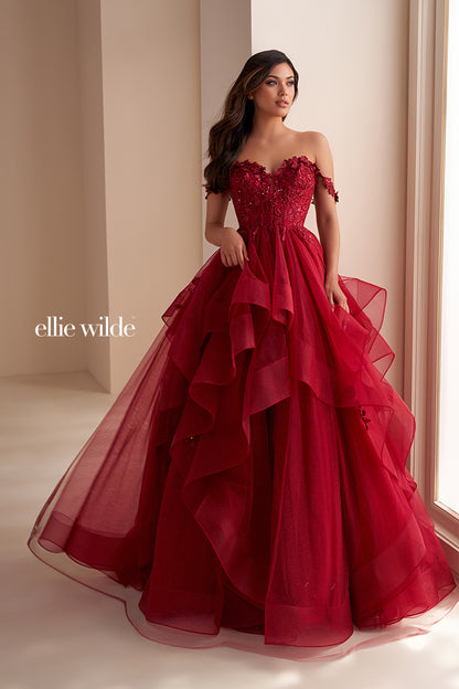Make a statement in the Ellie Wilde EW35084 prom dress. Featuring an off-the-shoulder top, shimmer sequin lace and ruffle detail, the dress offers a timeless and sophisticated look perfect for the big night. Keep it classic in this classic formal gown.

Sizes: 00-24

Colors: Bluebell, Diamond White, Dusty Rose/Gold, Emerald, Hot Pink, Lavender, Light Pink, Light Yellow, Navy, Red, Royal, Silver, Teal, Wine&nbsp;