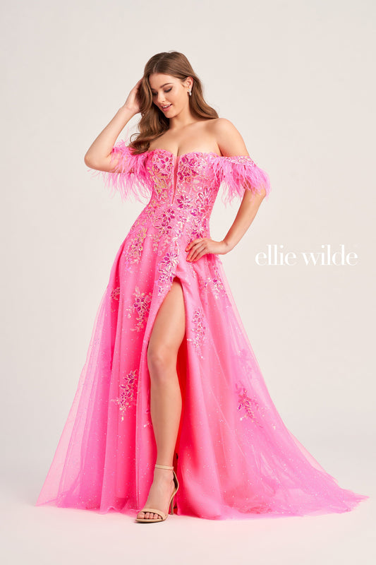 Look stunning at special occasions in this Ellie Wilde EW35220 ball gown. Crafted with a glitter tulle bodice, sequin appliqués, and a detachable draped off-shoulder feather strap design, this A-line silhouette features a plunging sweetheart neckline, pockets, a high slit, and separate spaghetti straps. The natural waistline sits above the long tulle skirt for an unforgettable red carpet-worthy look.  COLOR: EMERALD, HOT PINK, CERULEAN BLUE