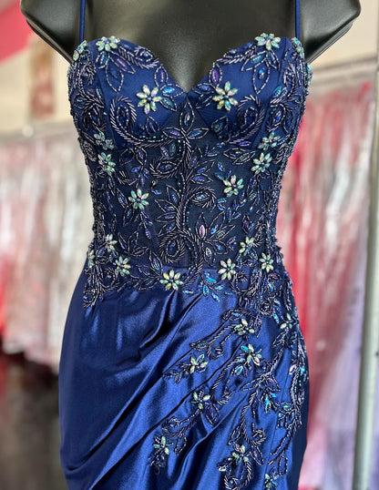This Nox Anabel G1659 gown in size 0 features a sophisticated navy satin fabric with a long, fitted silhouette that enhances your figure. The dress is adorned with delicate beadwork and crystals, adding refined sparkle. A sheer corset bodice offers subtle allure, while the slit skirt provides elegant movement and ease. Perfect for formal occasions, this gown combines classic craftsmanship with modern detailing for a standout look.

Size: 0

Color: Navy Blue