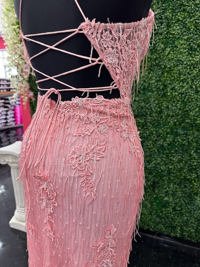Look chic and confident in the Johnathan Kayne 31608 Long Sheer Lace Corset Sequin Fringe Dress Slit Backless Formal. An intricate sheer lace corset bodice is paired with sequin fringe for a unique look and feel. Features a slit adorned with 3d lace, with a classic full-length gown silhouette. Bring out your best for any occasion.  *ONE OF A KIND  Size: 4  Color: Pink
