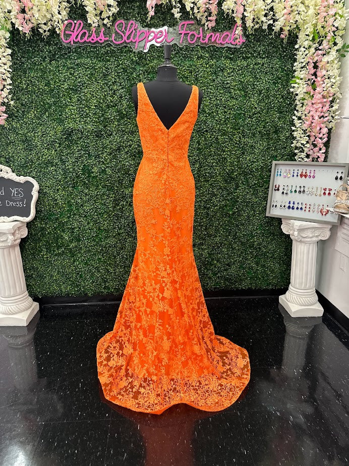 Look stunning in this Johnathan Kayne 31575 Size 4 Orange Lace V Neck Fitted Formal Prom Dress. Crafted from shimmering lace, this fitted design is sure to draw eyes. Show off your best features in this show-stopping dress.  Size: 4  Color: Orange