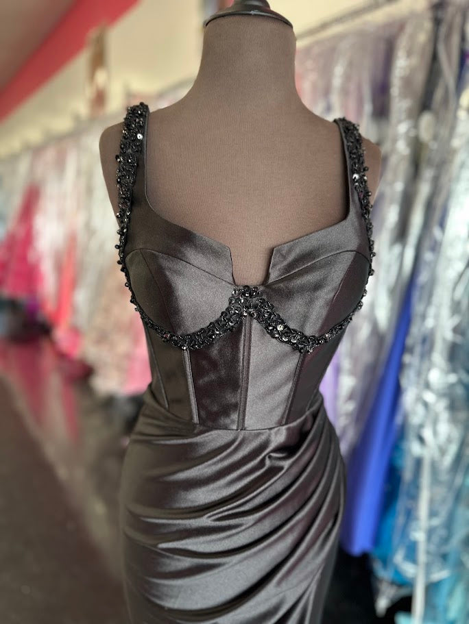 Elevate your formal occasion with the Nina Canacci 3271, a size 0 long fitted satin prom dress designed for a flawless silhouette. This elegant gown features a structured corset that enhances your shape, complemented by a daring slit for graceful movement. Intricate beading adds a touch of sophistication, making it perfect for evening events where style and refinement are paramount. Crafted to combine comfort with high fashion, this dress ensures you stand out with timeless elegance.

Size: 4

Color: Black