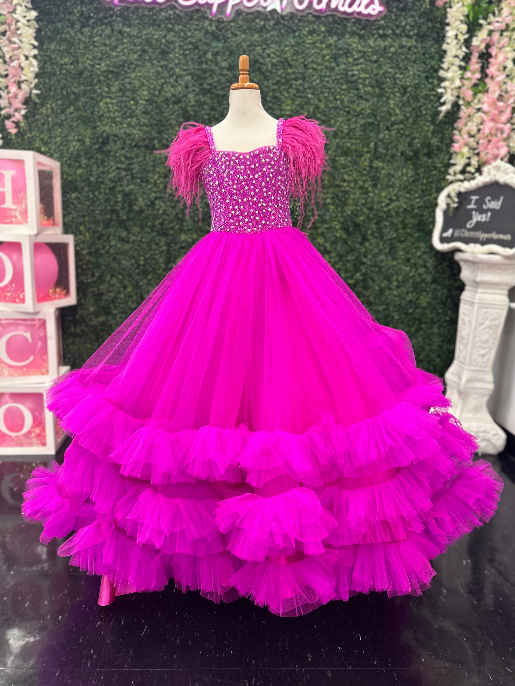 Sugar Kayne C327 features a fashionable pageant dress for girls and preteens, complete with feather straps, a tiered ruffle bottom, and a crystal stone bodice.&nbsp;Stand out and feel confident on stage! This tulle ballgown features ostrich feathers on the shoulders, a beaded bodice, and tiered skirt to show off your personality!

Colors:&nbsp; Aqua, Bubblegum, White, Magenta

Sizes:&nbsp;&nbsp;2, 4, 6, 8, 10, 12, 14, 16

(Sizes 2-6 do not have bust cups, Sizes 8-16 will have preteen size bust cups)