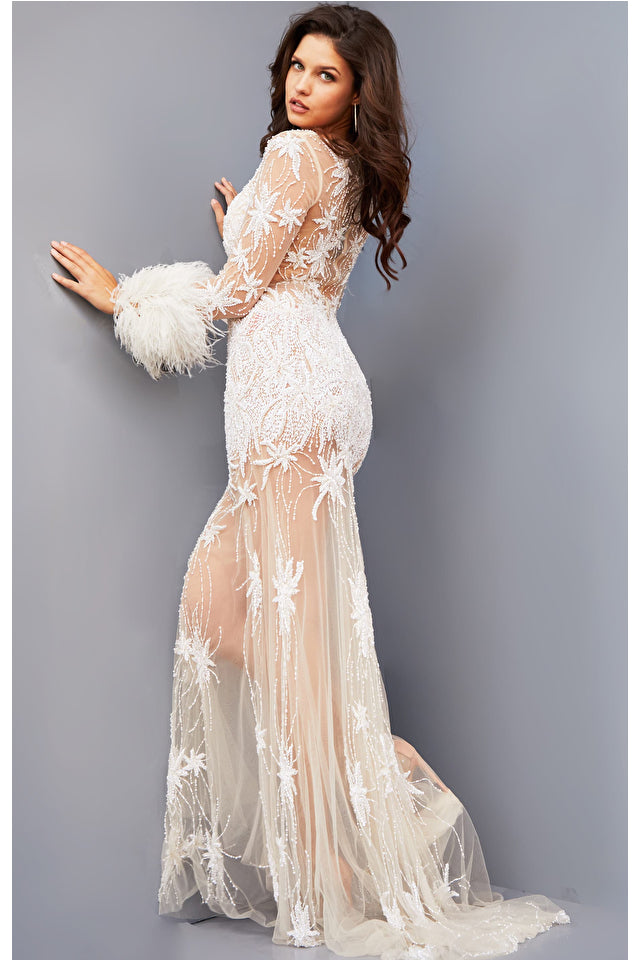 Jovani JB07527 White Embellished Illusion Feathered Embellished Cuffs Closed Sheer Back Long Sleeve Prom Dress. Upgrade your evening style with this Jovani JB07527 Prom Dress. Crafted from white crepe, this captivating design features a sheer illusion back, long sleeves with embellished feathered cuffs, and an array of sparkling beaded embellishments. Create a luxurious look that will make you shine on any special occasion.   