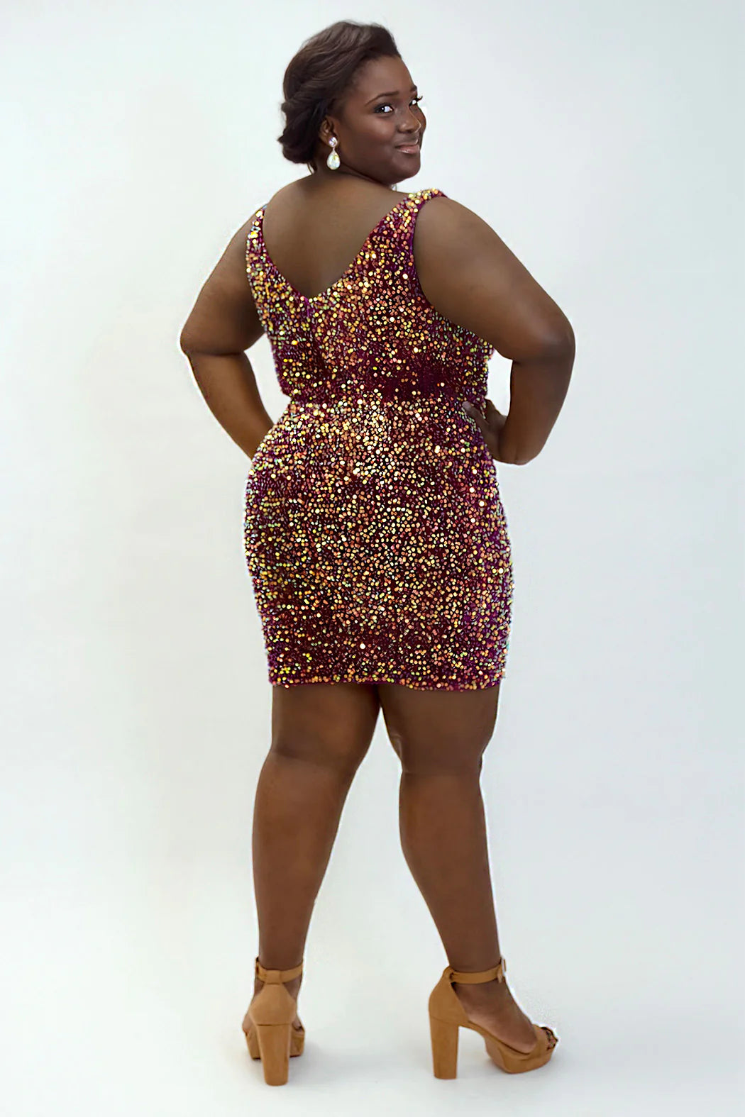 A perfect addition to any wardrobe, the Sydneys Closet JK2402 Velvet Sequin Plus Size Cocktail Dress is a gorgeous V Neck Formal Gown in a stunning sequin design. Cut with a sleek silhouette, this dress is sure to make a statement.Homecoming will be a sensation when you rock the stunning Sequin Secret Party cocktail dress! 